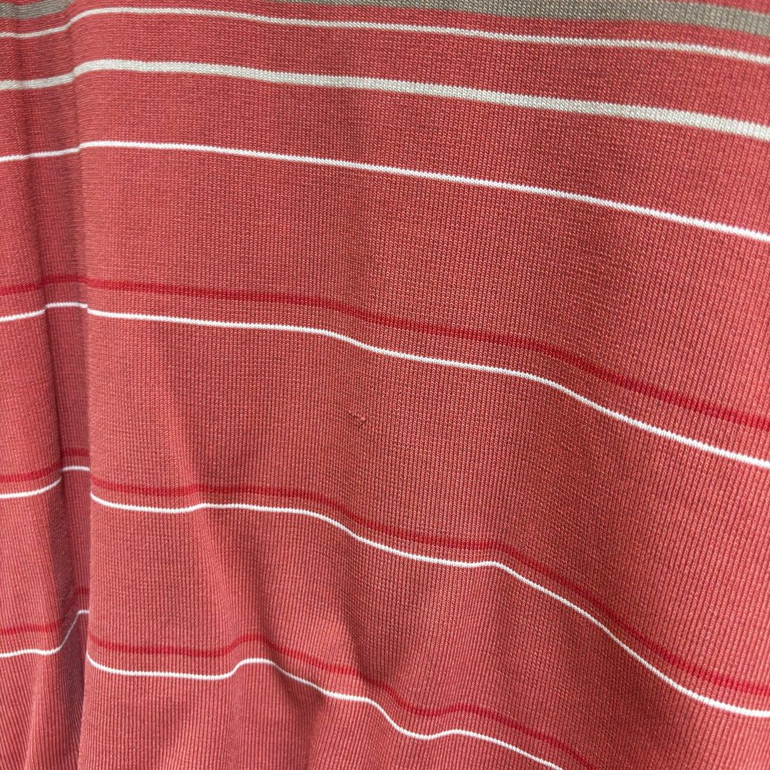 Striped Sleeveless Turtleneck Top (Category: Sleeveless) located in Balanga. Submitted by heyyletsdeclutter (Listing ID 1412202074, Image 2). Description: - Sleeveless top with turtleneck collar - Features horizontal stripes in red, white, and gray - Fitted silhouette - Made of knit material.