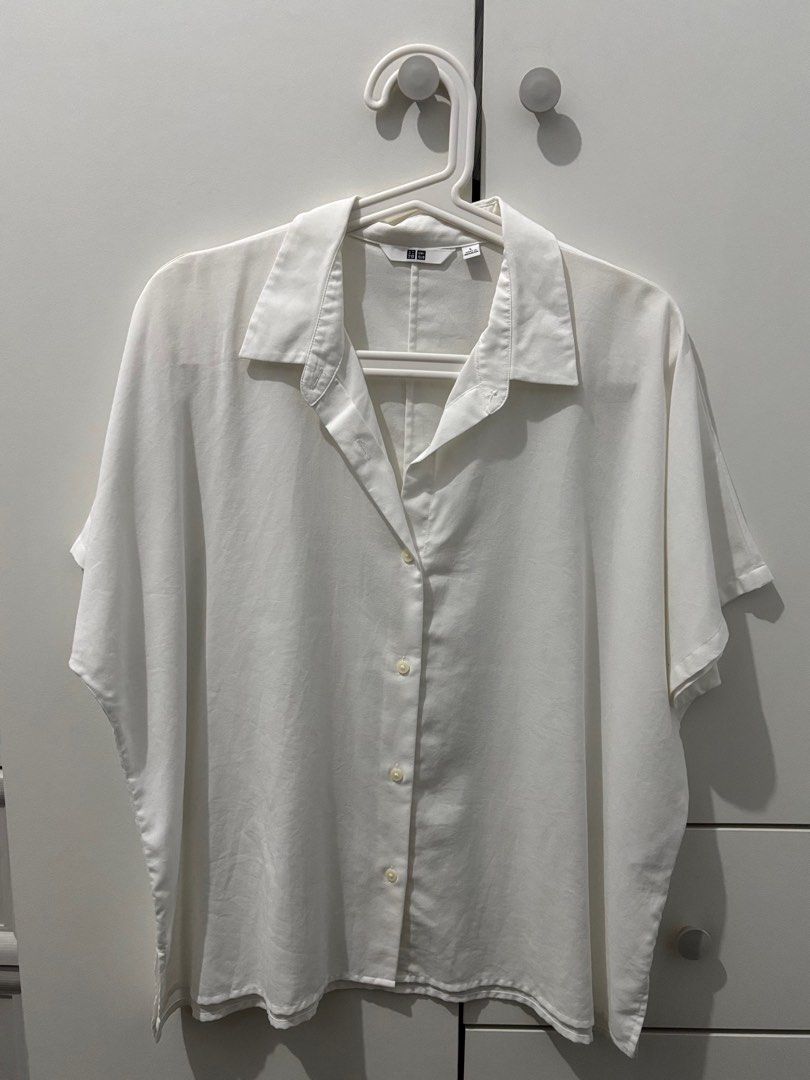Uniqlo White Button-Up Shirt (Category: Shirts) located in Manila. Submitted by decluttaro (Listing ID 1412282100, Image 1). Description: - Uniqlo White Button-Up Shirt - Size L - Excellent condition - Versatile design - Perfect for everyday wear RFS: DECLUTTERING USED TWICE ONLY.