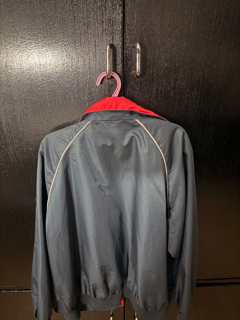 Vintage Blue and Red Jacket (Category: Coats, Jackets and Outerwear) located in Paranaque City. Submitted by jayvee7 (Listing ID 1412279702, Image 2). Description: - Vintage jacket with a blue and red color scheme. - Features a stylish red collar. - Convenient zipper closure. - Classic design with a comfortable fit. - Made from a lightweight material, ideal for layering. - Includes a logo on the front..