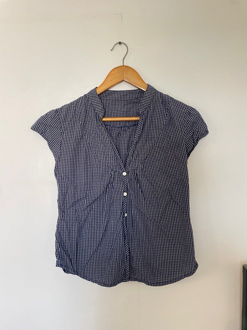 Y2K Blue Checkered Button-Down Blouse (Category: Blouses) located in Cavite. Submitted by _nicoffee (Listing ID 1412194847, Image 1). Description: - Blue and white checkered pattern - Lightweight fabric - Bust: 32-35in Length: 22.5in -Fits S-M.