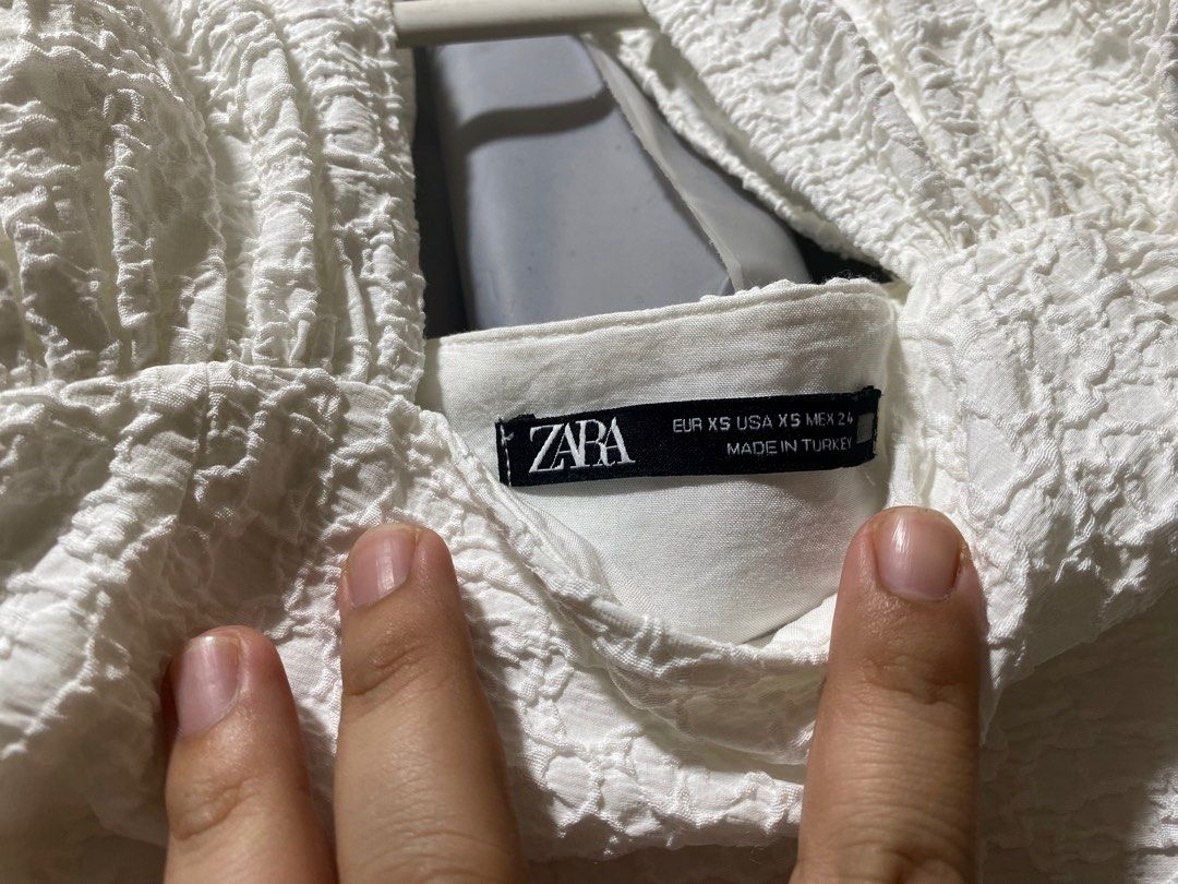 Zara Textured Top - XS (Category: Blouses) located in Pasay City. Submitted by _jkching (Listing ID 1412269714, Image 2). Description: - Zara white textured top - Open back design - Cap sleeves - Size: XS - Made in Turkey - Stylish and versatile.
