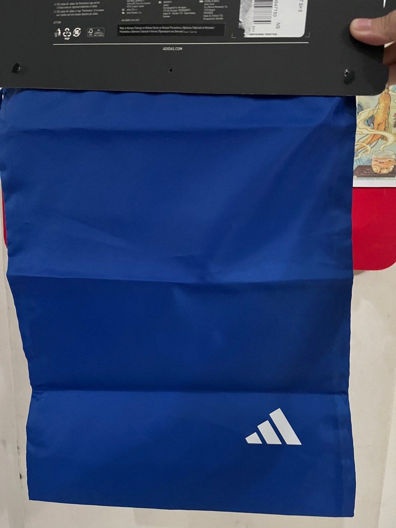 Adidas Drawstring Bag (Category: Backpacks) located in Quezon City. Submitted by shopby_a (Listing ID 1412409863, Image 2). Description: - Adidas drawstring bag - Color: Blue - Features white Adidas logo - Drawstring closure - New with original tag - Durable and lightweight material - Ideal for shoes, gym clothes, and essentials.
