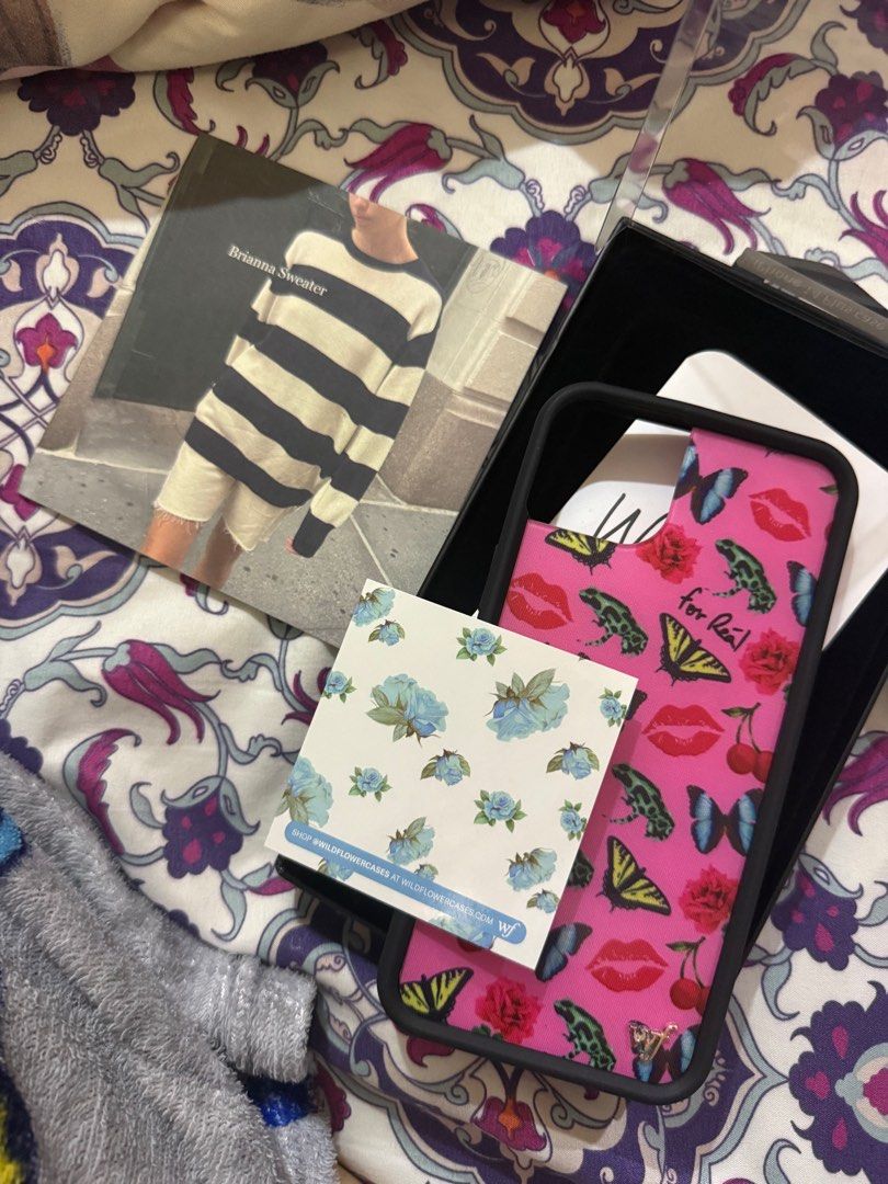 Authentic iPhone 14 Plus Wildflower Case Devon Lee Carlson x Wildflower (Category: Cases & Sleeves) located in Quezon City. Submitted by salmoncrunchroll (Listing ID 1412474486, Image 3). Description: • just received today 12-29-25 • got from a pasabuy! • the brandy melville must be a freebie from the seller • never been used bc it came when i already upgraded my phone 😭 • lp posted, won’t entertain offers.