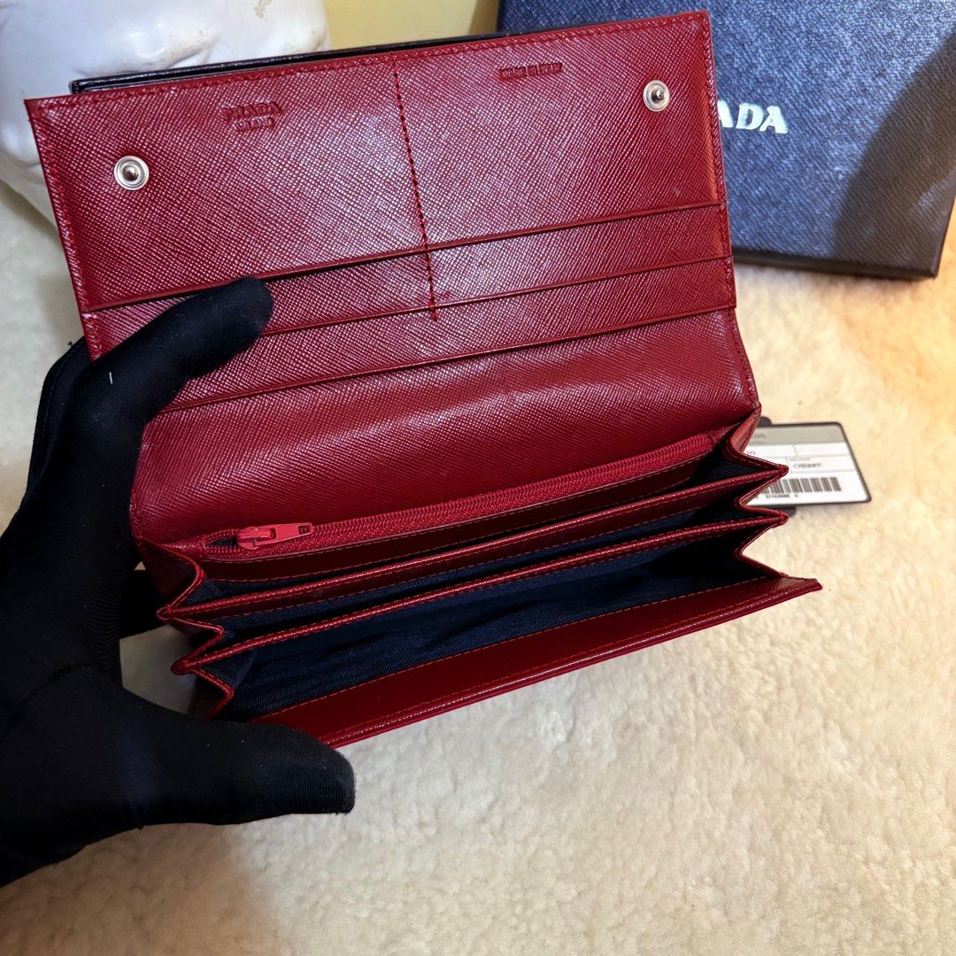 Authentic Prada Tessuto Cherry Red Long Wallet (Category: Luxury Bags & Wallets) located in Binangonan. Submitted by makoleksyon (Listing ID 1412363262, Image 2). Description: Excellent condition Like new No flaws Comes with box and authenticity card Bought in Japan.