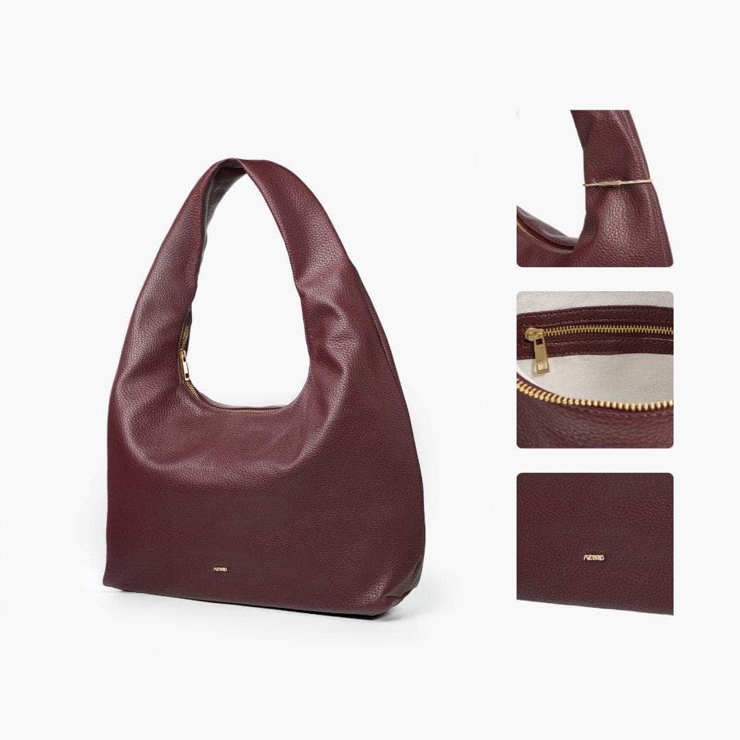 Aztrid XL Hobo Bag - Ox (Category: Shoulder Bags) located in San Fernando. Submitted by attiryes (Listing ID 1412496482, Image 1). Description: - Burgundy hobo bag - Spacious interior with zippered closure - Single shoulder strap - Subtle brand logo - Light-colored interior lining - Made of textured material.