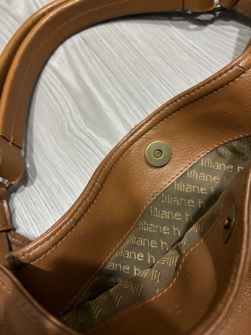 BCBG Vintage Brown Leather Bag (Category: Shoulder Bags) located in Manila. Submitted by prelovedbymfl (Listing ID 1412478794, Image 3). Description: - very good quality - genuine leather - fits alot - has inner compartments - bought frm ig thrift - minor cracks in opening.