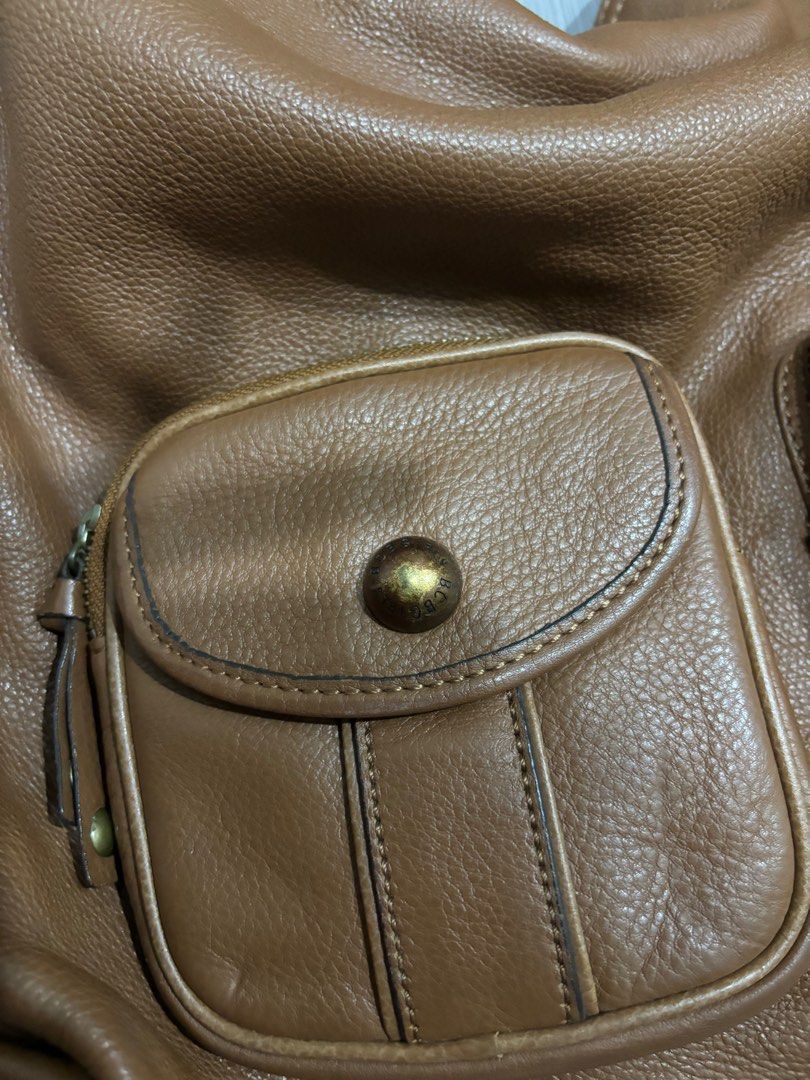 BCBG Vintage Brown Leather Bag (Category: Shoulder Bags) located in Manila. Submitted by prelovedbymfl (Listing ID 1412478794, Image 2). Description: - very good quality - genuine leather - fits alot - has inner compartments - bought frm ig thrift - minor cracks in opening.