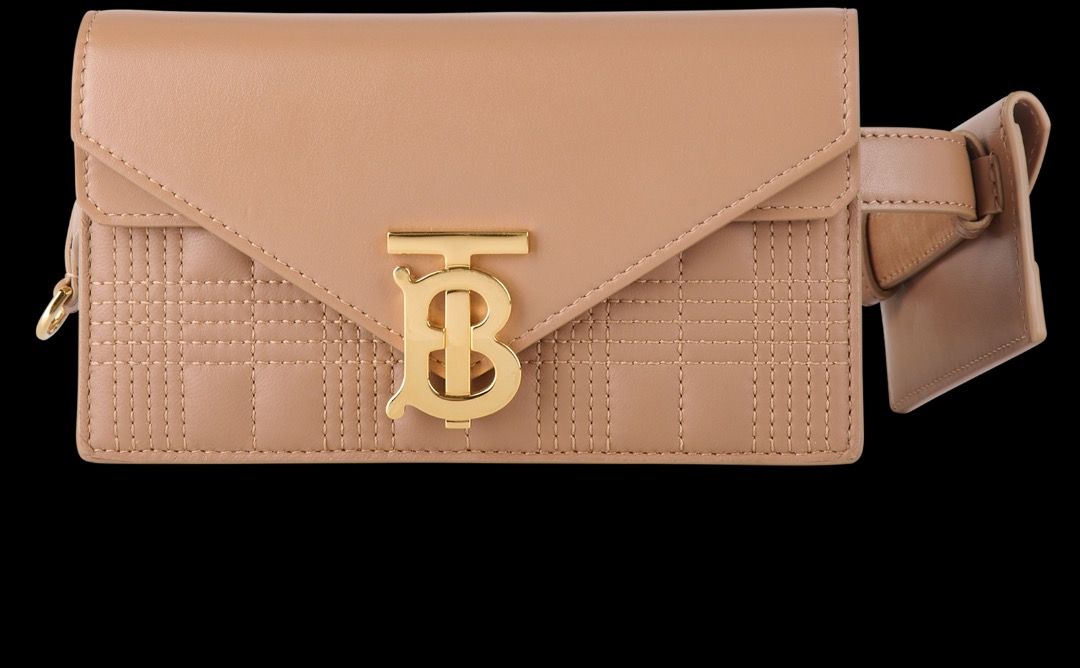 Burberry Quilted TB Belt Bag (Category: Luxury Bags & Wallets) located in Las Pinas. Submitted by eyes_jade (Listing ID 1412431641, Image 1). Description: - Burberry belt bag - Quilted design - TB logo - Tan color - Gold-toned hardware - Flap closure - Adjustable belt - Includes dust bag - Compact and stylish Size: 2cm x 10cm x 18cm.