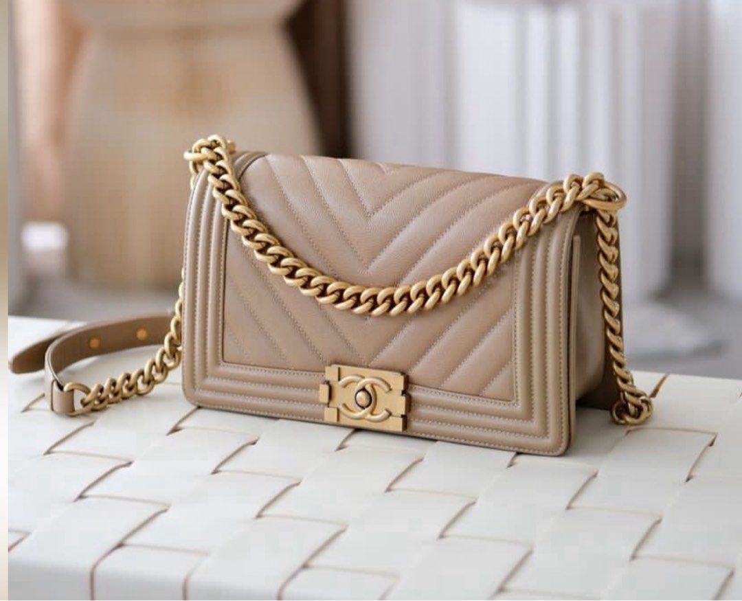 Chanel Boy Bag Dark Beige S25 (Category: Luxury Bags & Wallets) located in Paranaque City. Submitted by caredforgoods (Listing ID 1412418014, Image 1). Description: - Authentic Chanel Boy Bag - Color: Dark Beige - Features a gold chain strap - Classic Chanel lock - Quilted design in Caviar.