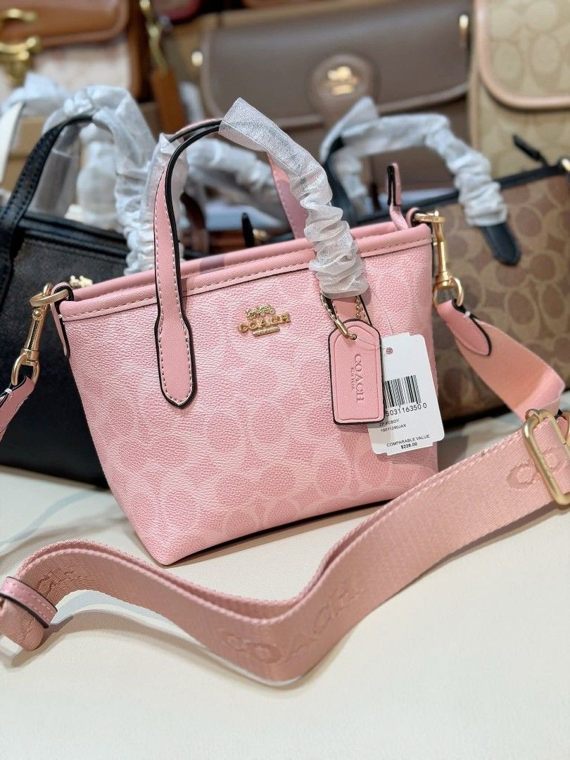 Coach Mini Tote Bag (Category: Luxury Bags & Wallets) located in Manila. Submitted by maricelbal37348 (Listing ID 1412350370, Image 1). Description: - Coach Mini Tote Bag - Available Colors: Pink, Cream, Brown - Features Coach logo and signature pattern - Includes detachable crossbody strap - Comes with a hang tag - Top handles and crossbody strap.