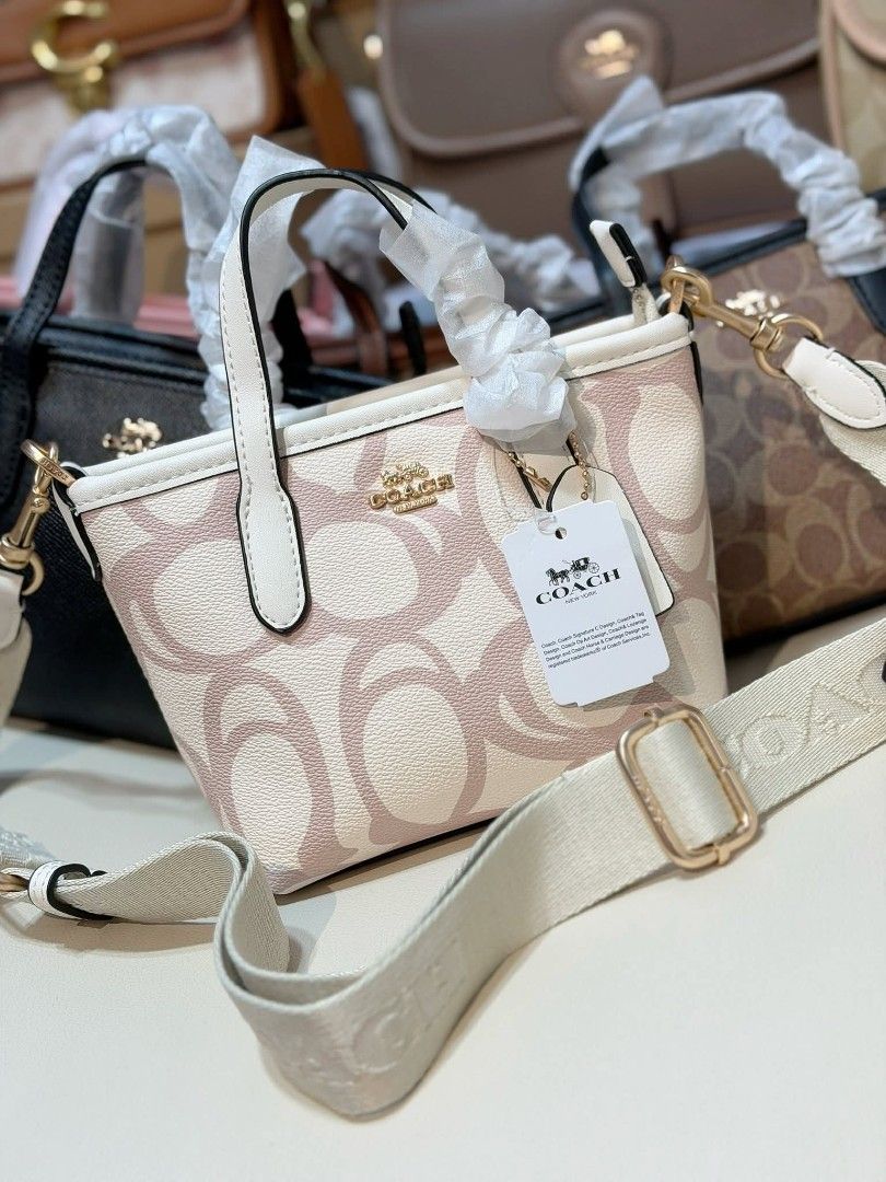 Coach Mini Tote Bag (Category: Luxury Bags & Wallets) located in Manila. Submitted by maricelbal37348 (Listing ID 1412350370, Image 2). Description: - Coach Mini Tote Bag - Available Colors: Pink, Cream, Brown - Features Coach logo and signature pattern - Includes detachable crossbody strap - Comes with a hang tag - Top handles and crossbody strap.