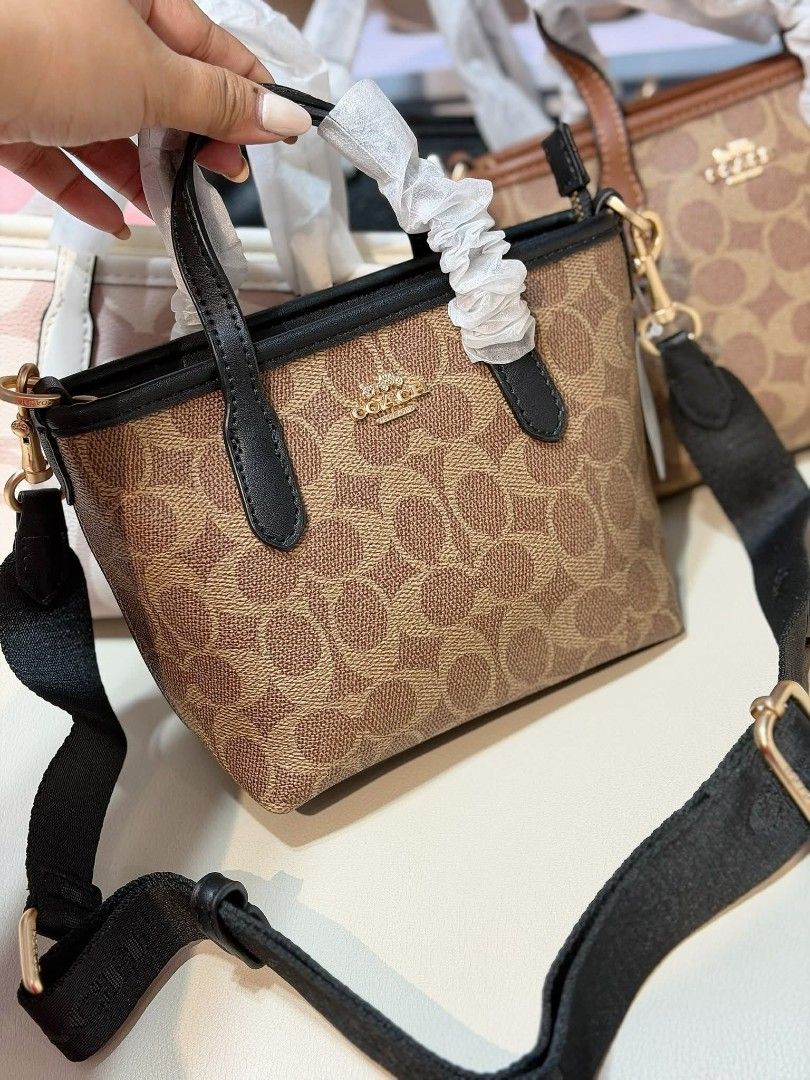 Coach Mini Tote Bag (Category: Luxury Bags & Wallets) located in Manila. Submitted by maricelbal37348 (Listing ID 1412350370, Image 3). Description: - Coach Mini Tote Bag - Available Colors: Pink, Cream, Brown - Features Coach logo and signature pattern - Includes detachable crossbody strap - Comes with a hang tag - Top handles and crossbody strap.