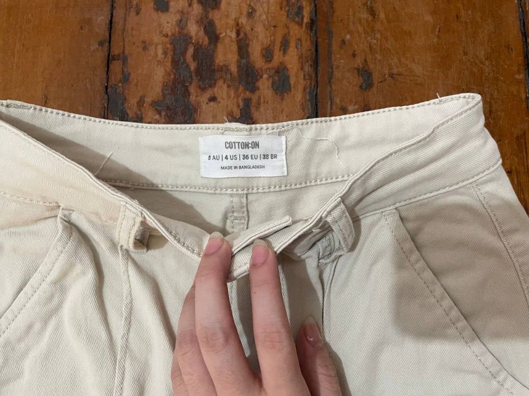 Penshoppe Midi Skirt (Category: Skirts) located in Quezon City. Submitted by declutterhouse (Listing ID 1412390713, Image 2). Description: - Brand: Penshoppe - Color: Beige - Features: Button closure, pockets - Style: Straight cut - Material: Sturdy fabric - Size: Please refer to the size tag in the photos - Versatile: Neutral color, easy to match with different outfits.