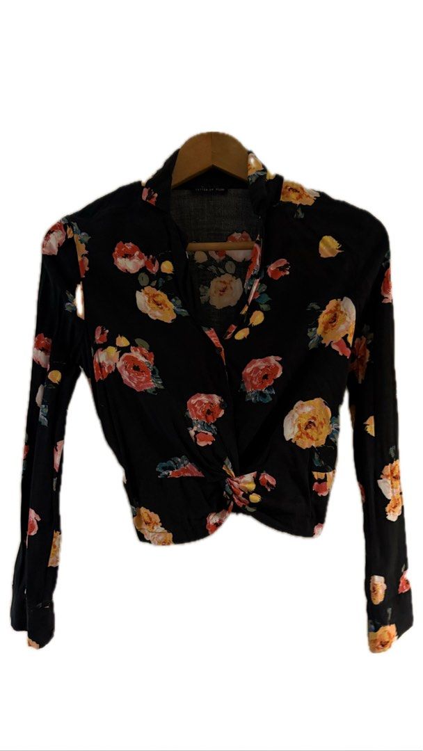Floral Black Blouse (Category: Blouses) located in Binan City. Submitted by incairo (Listing ID 1412353371, Image 1). Description: - Black blouse - Floral pattern with red, yellow, and white flowers - Long sleeves - Twisted knot waist detail - V-neckline - Lightweight fabric.