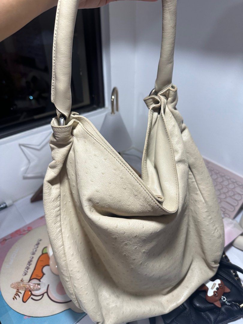 Furla Hobo Bag (Category: Luxury Bags & Wallets) located in Quezon City. Submitted by aceccrts (Listing ID 1412487580, Image 3). Description: - Original Cream-colored Furla hobo bag - Textured leather exterior - Comfortable single shoulder strap - Spacious interior - Features the Furla logo Dimensions: Width (at bottom): Around 14 inches (approx. 36 cm). Height: Approximately 33-38 cm (13-15 inches). Depth: Around 12-14 cm (4.7-5.5 inches). Handl
