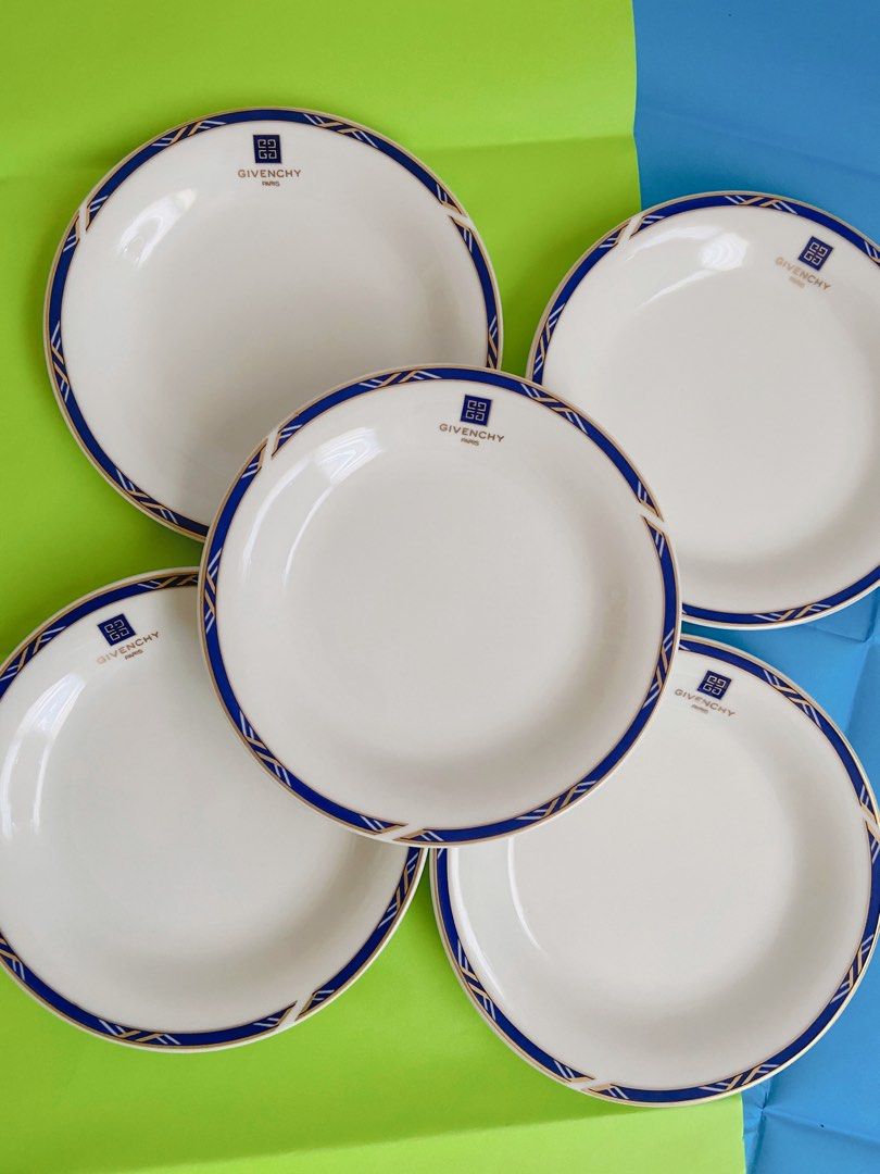 Givenchy Paris Plates (Category: Dinnerware & Cutlery) located in Binangonan. Submitted by pinkesceeluxe (Listing ID 1412479156, Image 1). Description: - Set of Givenchy Paris plates - Classic white base - Beautiful blue and gold border design - Features the iconic Givenchy logo - Adds a touch of sophistication to your table setting Set of 5 - Php2500.