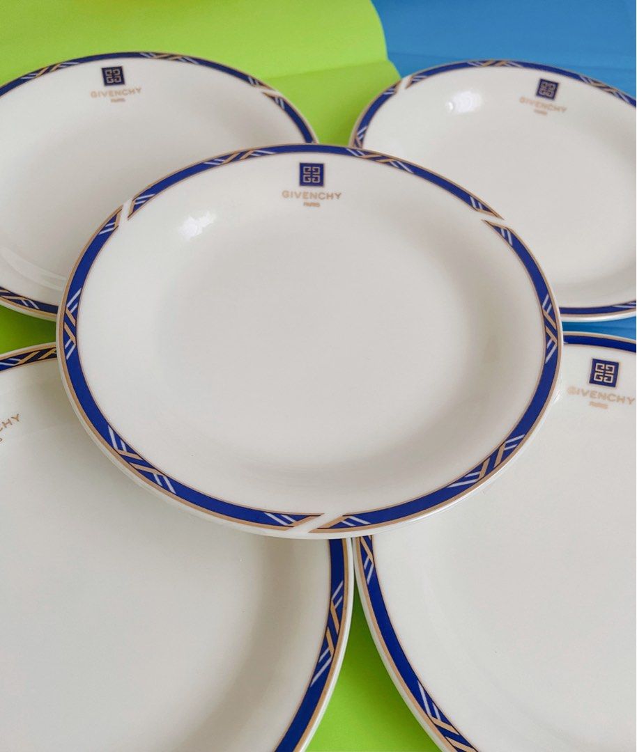 Givenchy Paris Plates (Category: Dinnerware & Cutlery) located in Binangonan. Submitted by pinkesceeluxe (Listing ID 1412479156, Image 2). Description: - Set of Givenchy Paris plates - Classic white base - Beautiful blue and gold border design - Features the iconic Givenchy logo - Adds a touch of sophistication to your table setting Set of 5 - Php2500.