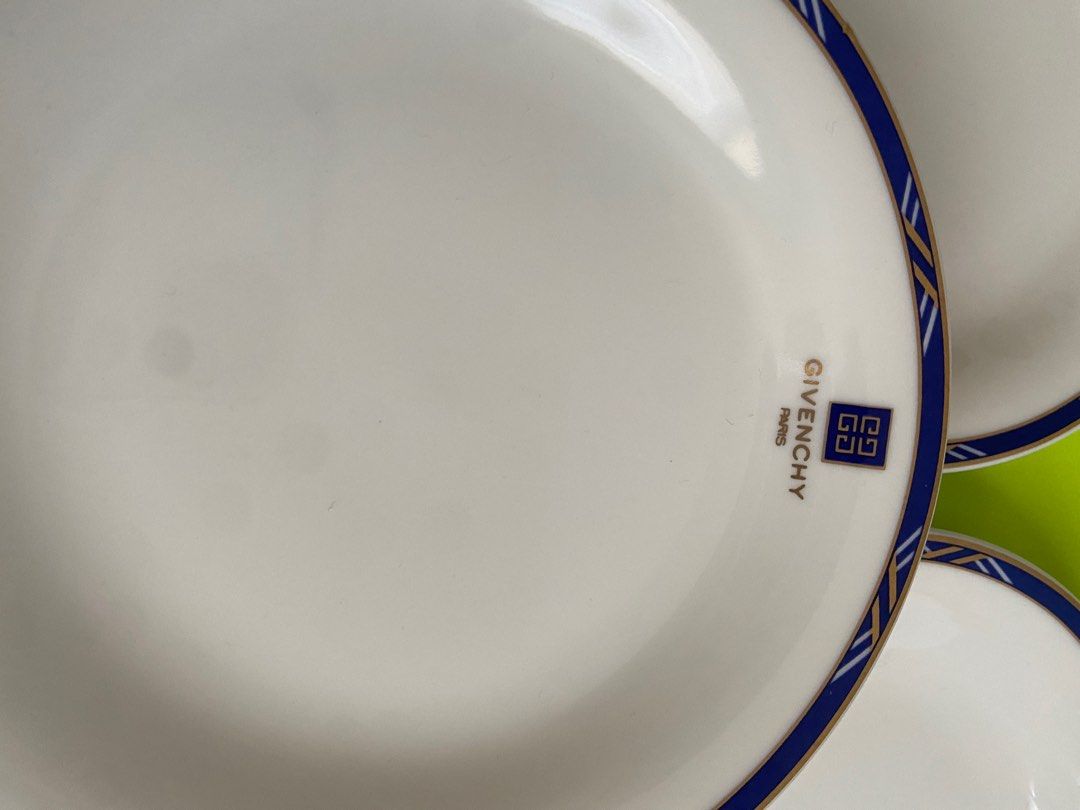 Givenchy Paris Plates (Category: Dinnerware & Cutlery) located in Binangonan. Submitted by pinkesceeluxe (Listing ID 1412479156, Image 3). Description: - Set of Givenchy Paris plates - Classic white base - Beautiful blue and gold border design - Features the iconic Givenchy logo - Adds a touch of sophistication to your table setting Set of 5 - Php2500.