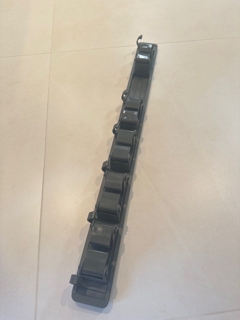 Hanging rack (Category: Storage & Organization) located in Singapore. Submitted by lydia929 (Listing ID 1412426708, Image 1). Description: brand new You can drill holes or glue them. Five card slots and six clips length 60 cm Mop wall-mounted clip buckle broom mop storage rack bathroom toilet no-drill strong hook bracket.