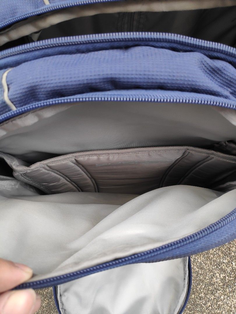 High Sierra Rolling Backpack (Category: Backpacks) located in Quezon City. Submitted by j.c.declutter (Listing ID 1412361212, Image 3). Description: - High Sierra rolling backpack - Navy blue color - Multiple compartments and pockets for organization - Retractable handle and wheels for easy rolling - Padded back panel for comfort - Shoulder straps for carrying - Functional zippers - Original Price 8000.