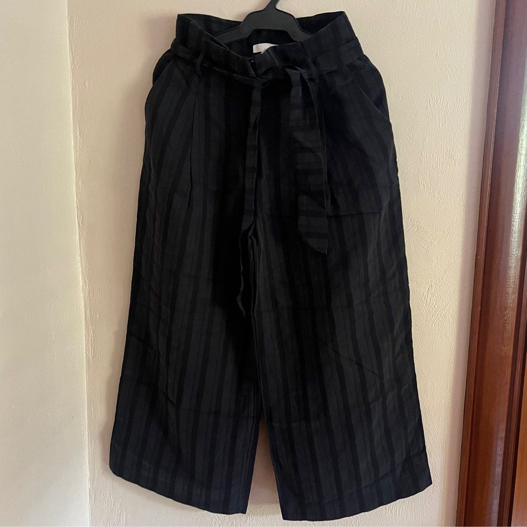 H&M Black Striped Culottes in Size S (Category: Other Bottoms) located in Marikina City. Submitted by jamieas (Listing ID 1412353005, Image 2). Description: - H&M Black Culottes - Vertical striped pattern - Includes a belt - Wide leg design - Size: EUR 36, UK 8, CN 165/66A - Perfect for a chic and comfortable style.