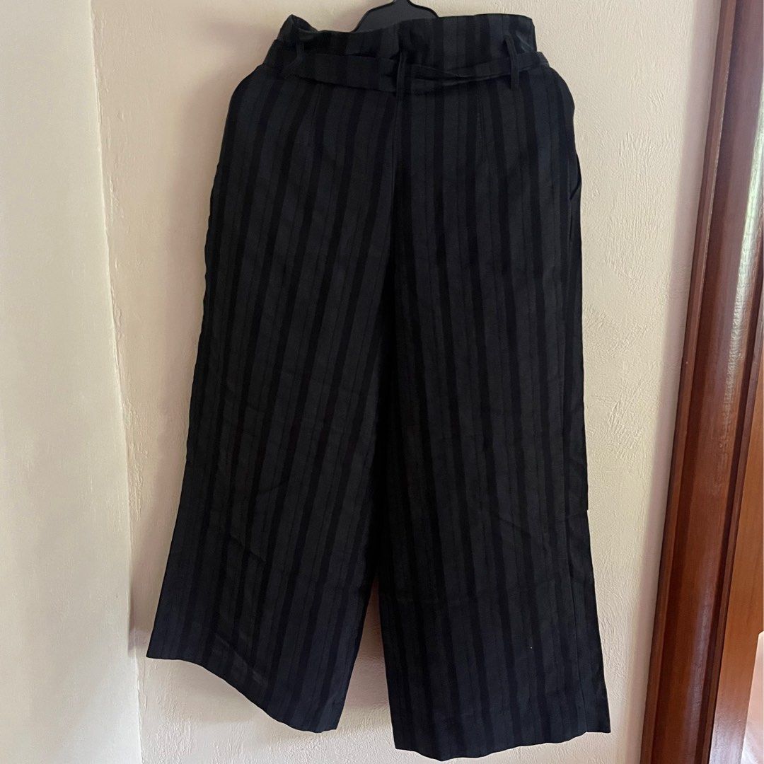 H&M Black Striped Culottes in Size S (Category: Other Bottoms) located in Marikina City. Submitted by jamieas (Listing ID 1412353005, Image 3). Description: - H&M Black Culottes - Vertical striped pattern - Includes a belt - Wide leg design - Size: EUR 36, UK 8, CN 165/66A - Perfect for a chic and comfortable style.