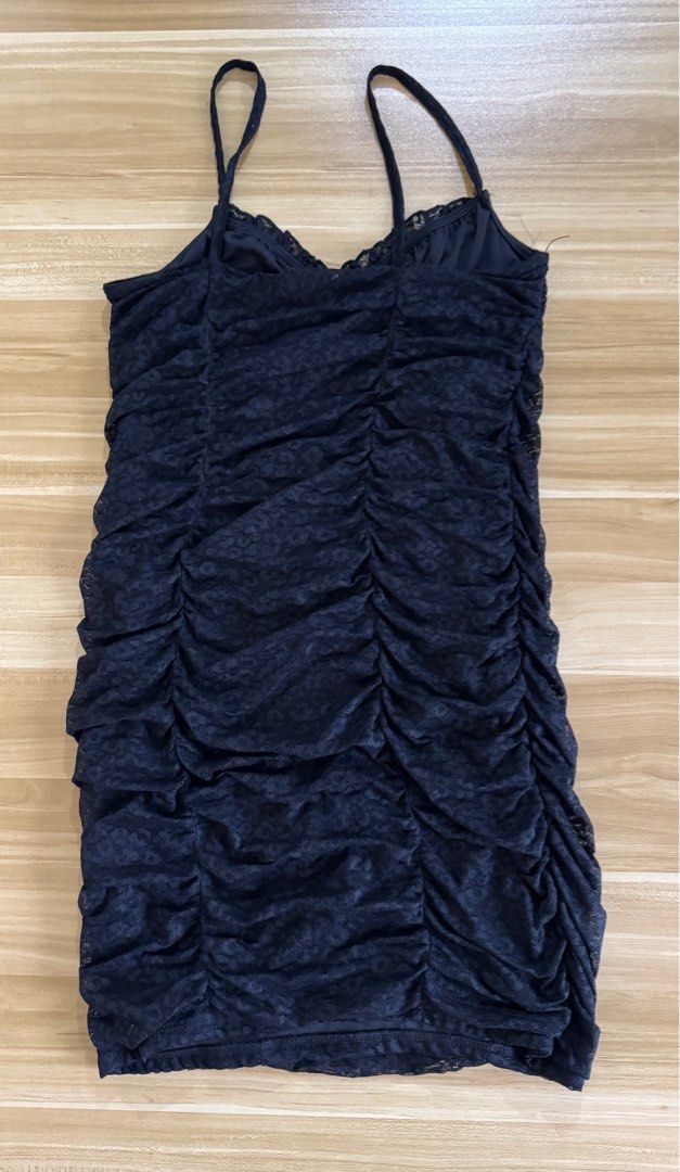 H&M Divided Black Ruched Dress (Category: Dresses) located in Quezon City. Submitted by mristl (Listing ID 1412380661, Image 3). Description: - Bought from physical store - Size M (11.5 x 24 manual measure) - Spaghetti straps - Lace trim on neckline - Tie detail at bust - Textured fabric.