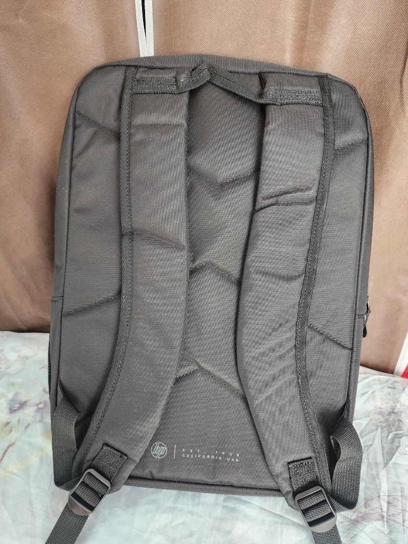 HP Gaming Backpack (Category: Backpacks) located in Santo Tomas. Submitted by mieu_declutters (Listing ID 1412387517, Image 2). Description: - Bought in Malaysia - Sleek black HP backpack with green accents. - Dedicated laptop sleeve. - Multiple compartments for organization. - Comfortable padded shoulder straps. - Reflective details for enhanced visibility. - Spacious interior, perfect for everyday use..