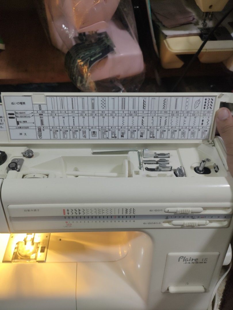 Janome Plaire 18 Sewing Machine (Category: Craft Supplies & Tools) located in Manila. Submitted by faststone-c3c8 (Listing ID 1412514413, Image 3). Description: Janome Plaire 18 sewing machine. Features multiple stitch patterns and adjustable settings. Includes a storage compartment with various accessories. The machine has a built-in light for better visibility..