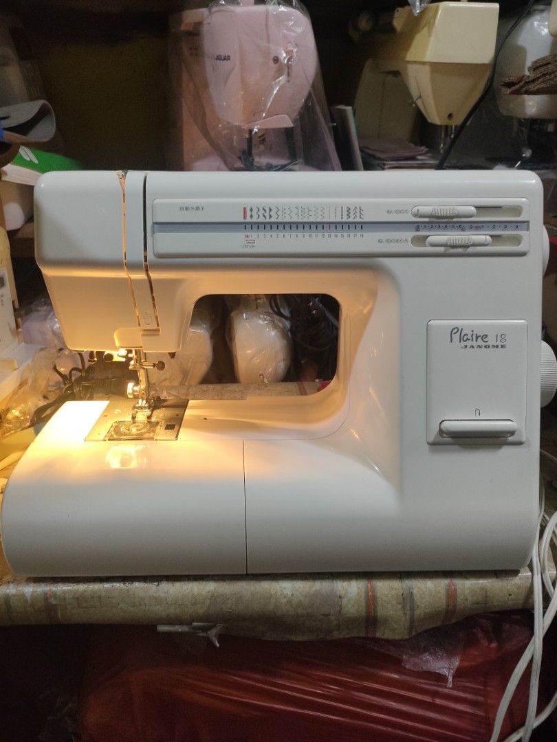 Janome Plaire 18 Sewing Machine (Category: Craft Supplies & Tools) located in Manila. Submitted by faststone-c3c8 (Listing ID 1412514413, Image 1). Description: Janome Plaire 18 sewing machine. Features multiple stitch patterns and adjustable settings. Includes a storage compartment with various accessories. The machine has a built-in light for better visibility..