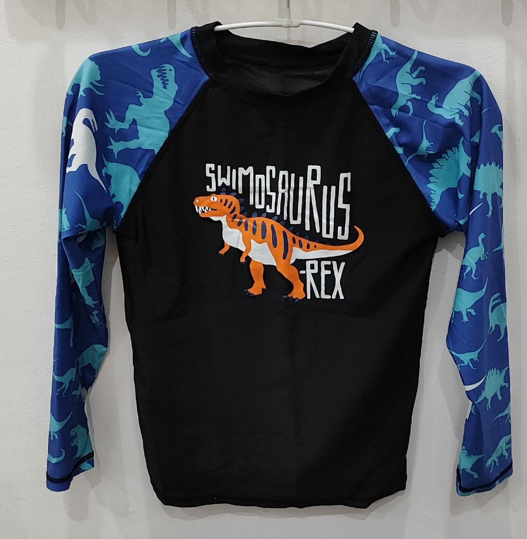 Kids Rashguard Set Blue Dinosaur (Category: Babies & Kids Fashion) located in General Trias. Submitted by versaillerose (Listing ID 1412400123, Image 1). Description: - Black rashguard with blue dinosaur sleeves - Long sleeves for sun protection - Crew neck design - Perfect for swimming! 📌 TERMS - Shipping Fee c/o buyer (not yet included in the price) - No reservation. First to pay basis. - Payment first before pick-up or shipping. - Price is al