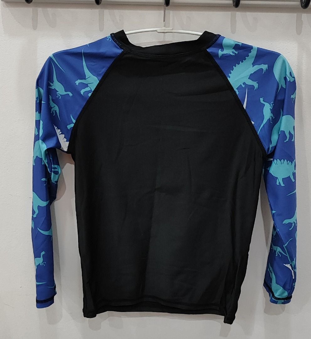 Kids Rashguard Set Blue Dinosaur (Category: Babies & Kids Fashion) located in General Trias. Submitted by versaillerose (Listing ID 1412400123, Image 2). Description: - Black rashguard with blue dinosaur sleeves - Long sleeves for sun protection - Crew neck design - Perfect for swimming! 📌 TERMS - Shipping Fee c/o buyer (not yet included in the price) - No reservation. First to pay basis. - Payment first before pick-up or shipping. - Price is al