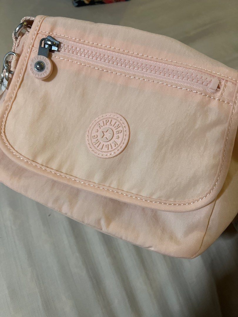 Kipling Crossbody Bag - Peach color (Category: Cross-body Bags) located in San Fernando. Submitted by _prelovedbysflp (Listing ID 1412428294, Image 2). Description: Kipling Sabian $54 = ₱ 3,177.20 .