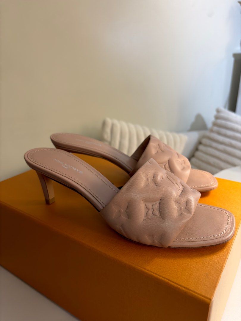 Authentic Louis Vuitton Revival Mule (Category: Sneakers & Footwear) located in Pasig City. Submitted by veees (Listing ID 1412411936, Image 2). Description: - Authentic Louis Vuitton Revival Mule - 2.2 inch heel - Leather outsole - Nude color - Monogram-embossed lambskin - Size 37, but fits 36 better - Includes original box, dust bag, and LV paper bag - Brand new, never used, only kept inside the box. - Selling for a lower price, original price 