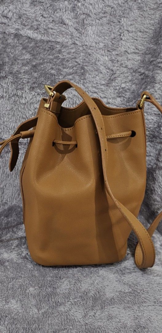 Miu Miu Logo Embossed Bucket bag (Category: Luxury Bags & Wallets) located in Alburquerque. Submitted by parchiracollection (Listing ID 1412461958, Image 2). Description: *Please self-authenticate *Please check detailed pics before making an offer *Plus SF *Courier: J&T (no rush shipping) *MOP: Gcash *No to low ballers *Up to 2 days reservation only.