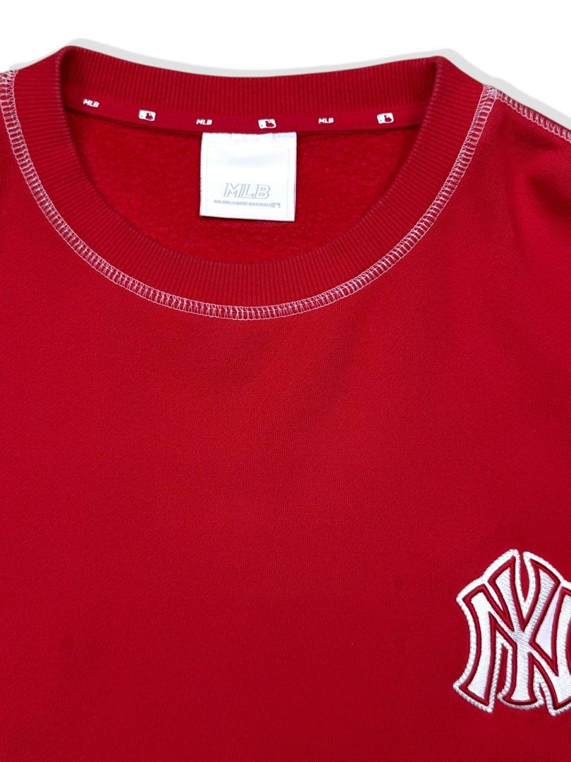 MLB New York Yankees Red Sweatshirt (Category: Coats, Jackets and Outerwear) located in Cebu City. Submitted by stylehub_ (Listing ID 1412358363, Image 2). Description: - Red New York Yankees sweatshirt -Size: XL -Width: 26 -Length: 31 - Features the iconic Yankees logo on the chest - "Yankees" detail on the sleeve - White stitching accents - Includes MLB tag, confirming authenticity - Made from comfortable material - Perfect for casual everyday 