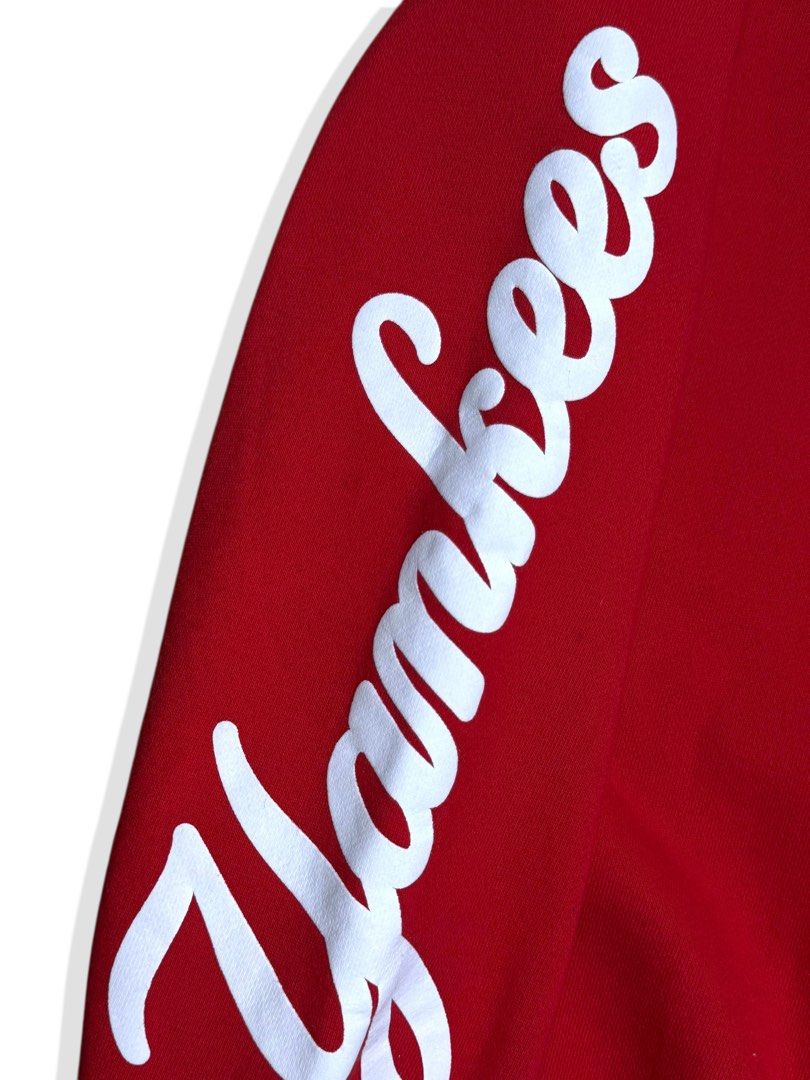 MLB New York Yankees Red Sweatshirt (Category: Coats, Jackets and Outerwear) located in Cebu City. Submitted by stylehub_ (Listing ID 1412358363, Image 3). Description: - Red New York Yankees sweatshirt -Size: XL -Width: 26 -Length: 31 - Features the iconic Yankees logo on the chest - "Yankees" detail on the sleeve - White stitching accents - Includes MLB tag, confirming authenticity - Made from comfortable material - Perfect for casual everyday 