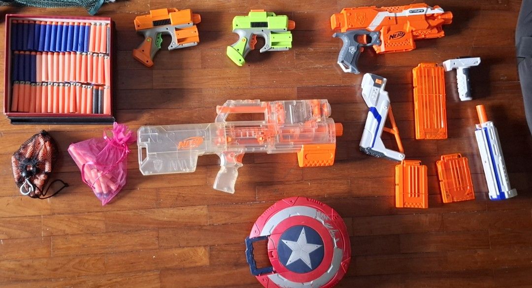Nerf Gun Bundle - Various Models (Category: Action & Battle Toys) located in Singapore. Submitted by jovan_ (Listing ID 1412378330, Image 2). Description: USED Nerf Guns for sale CHEAP Prices are shown in the listed photo Items in the photo inlcudes: 1x NERF DEPLOY CS-6 2x VINTAGE NERF VELCRO DART BLASTERS 1x NERF STRYFE Various nerf attachments 9x Nerf suction darts (in pink bag) 15x Nerf Velcro darts (in black mesh bag) 108x Assorted Nerf Darts