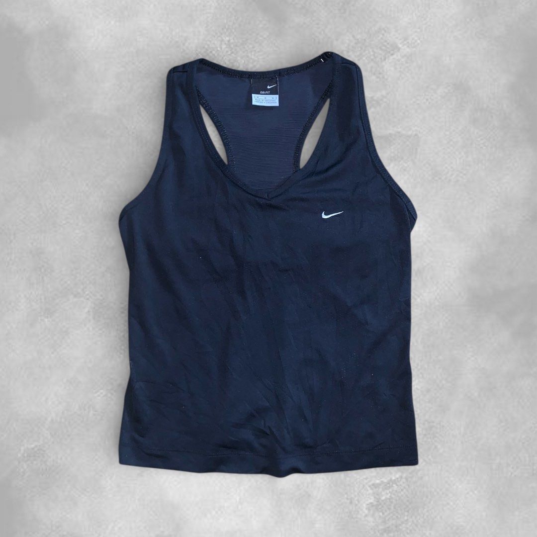 Nike Dri-FIT Black Tank Top (Category: Activewear) located in Cebu City. Submitted by peakstuffs (Listing ID 1412354798, Image 1). Description: - Black Nike Dri-FIT tank top - V-neck and racerback design - Features a small Nike logo - Style code: F40706800 - RN: 56323 - Breathable material - Perfect for workouts or casual wear.