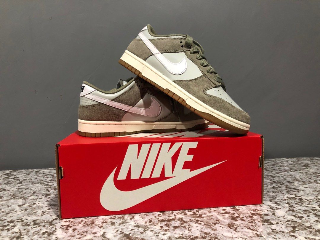 Nike Dunk Low Retro SE - Light Army (Category: Sneakers) located in Maasin. Submitted by niconii090 (Listing ID 1412351708, Image 1). Description: ✅AUTHENTIC BRAND NEW - Nike Dunk Low Retro SE - Light Army colorway - Size US 10 - Features light green and white color scheme with gum sole - Includes original box - Nike logo on tongue and heel - Nike logo on insole.