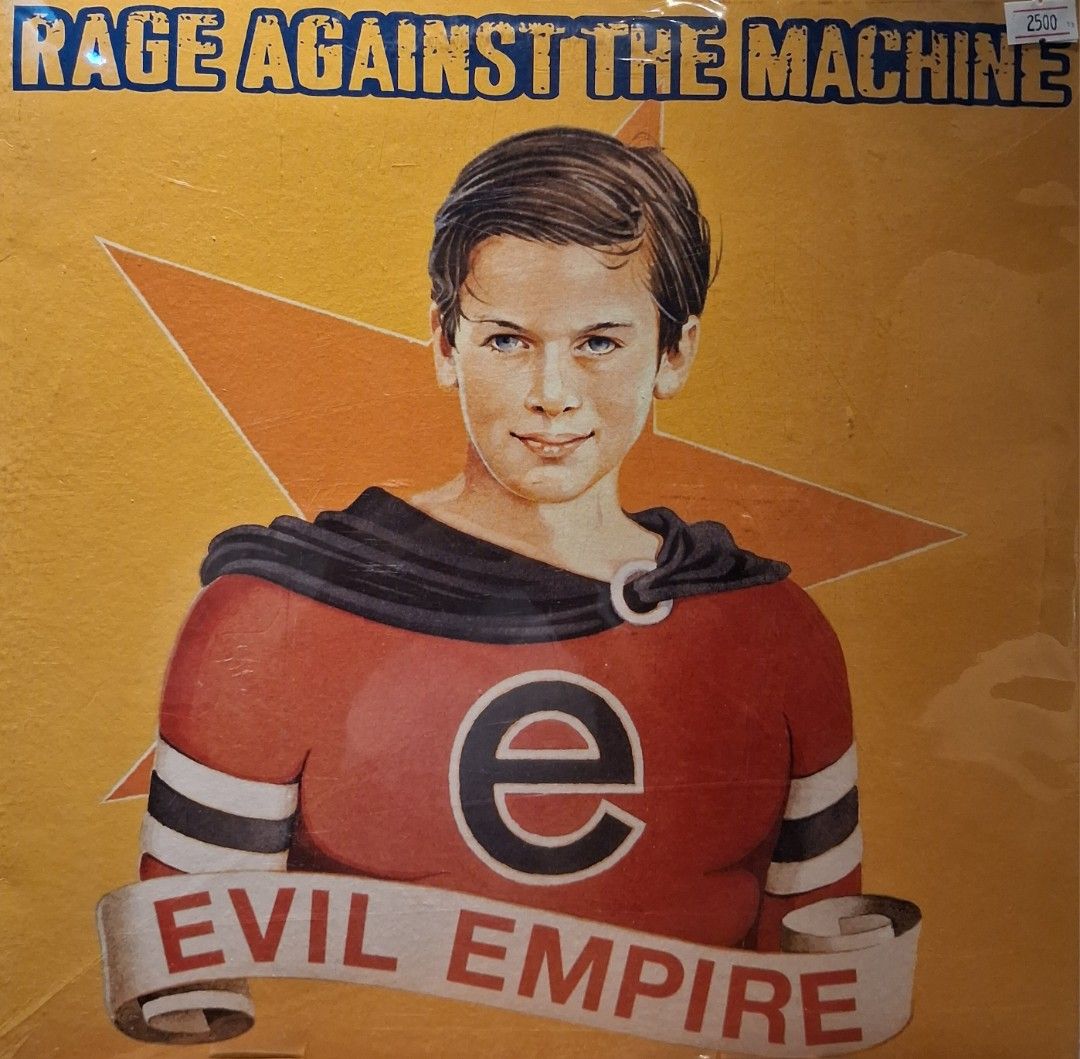 Rage Against the Machine - Evil Empire Vinyl Record (Category: Vinyls) located in Quezon City. Submitted by pooh_laa (Listing ID 1412339739, Image 1). Description: - Rage Against the Machine "Evil Empire" vinyl record - Features album artwork and title - Original packaging included - Price tag visible - Perfect for music collectors!.