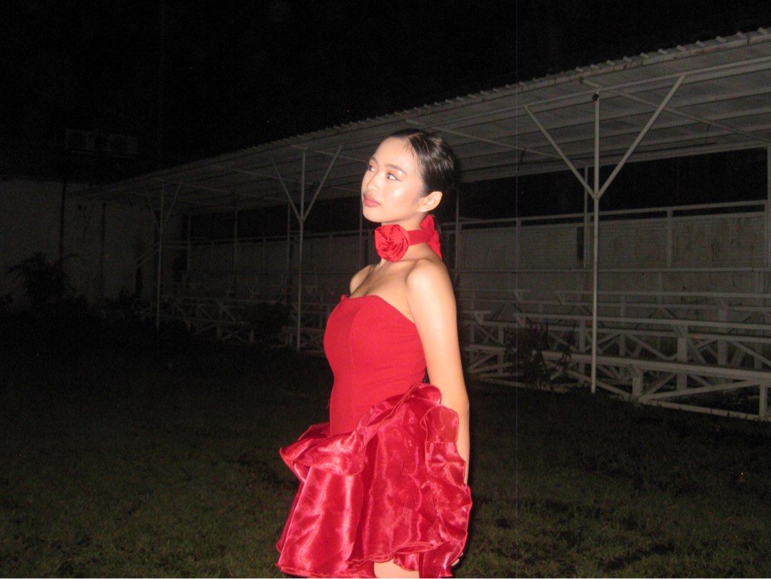 Shein Red Mini Dress (Category: Dresses) located in Daet. Submitted by calli.declutter (Listing ID 1412456954, Image 3). Description: - Used once in an event - Can fit xs-s - Red strapless mini dress - Fitted bodice and ruffled skirt - Includes matching red choker with rose detail - Perfect for special occasions - Made of shiny, satin-like fabric - Flattering silhouette.