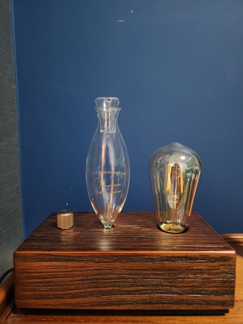 Retro Diffuser with light (Category: Home Fragrance) located in Singapore. Submitted by wiky_1708 (Listing ID 1412341699, Image 1). Description: Diffuser with light built in battery and rechargable (USB) Comes with light bulb Waterless essential oil Diffuser..