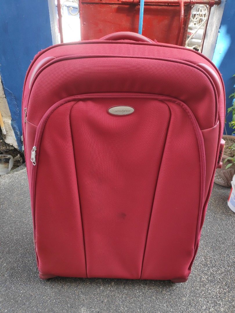 Samsonite Red Luggage with TSA Lock (Category: Luggage) located in Quezon City. Submitted by j.c.declutter (Listing ID 1412356891, Image 1). Description: - Red Samsonite suitcase - Features a TSA lock for security - Retractable handle for easy maneuvering - Multiple interior compartments - Medium size, ideal for travel - Unique patterned interior lining - Original Price 12000.