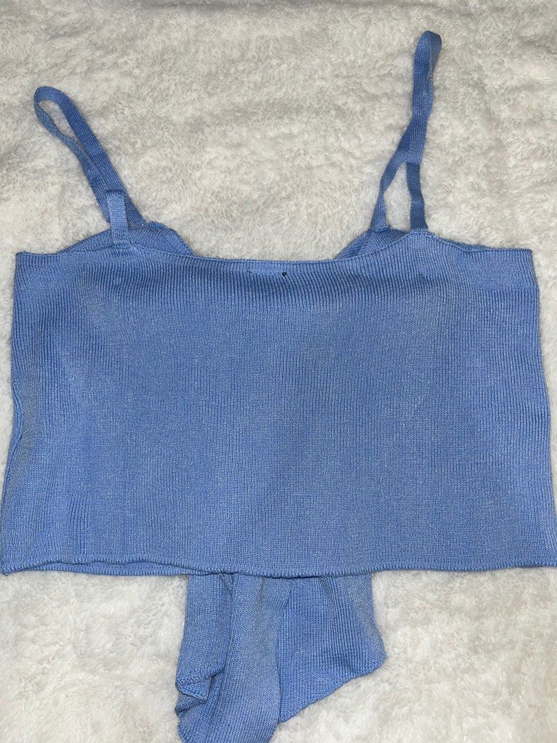 Shein Bow Detail Crop Top (Category: Sleeveless) located in Santa Rita. Submitted by supernicsss (Listing ID 1412407195, Image 2). Description: - Shein crop top - Unique bow detail - Adjustable straps - Ribbed knit texture - Light blue color - Straight neckline at the back - Perfect for various occasions.