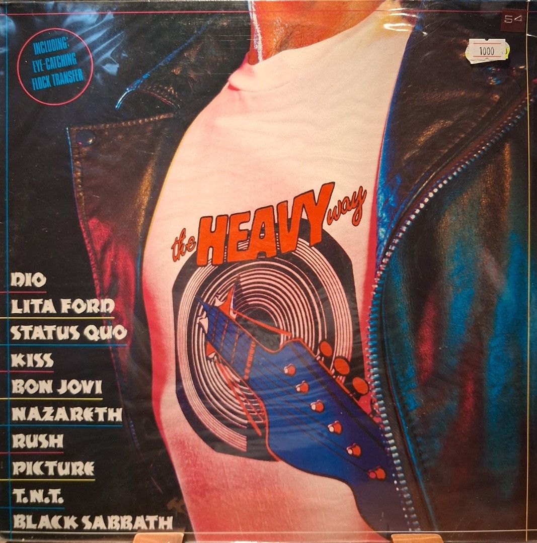 The Heavy Way Vinyl Record (Category: Vinyls) located in Quezon City. Submitted by pooh_laa (Listing ID 1412390355, Image 1). Description: - Rock vinyl record with artists: Dio, Lita Ford, Status Quo, Kiss, Bon Jovi, Nazareth, Rush, Picture, T.N.T., and Black Sabbath. - Includes a rock transfer. - Album cover art on the back. - Stereo pressing..