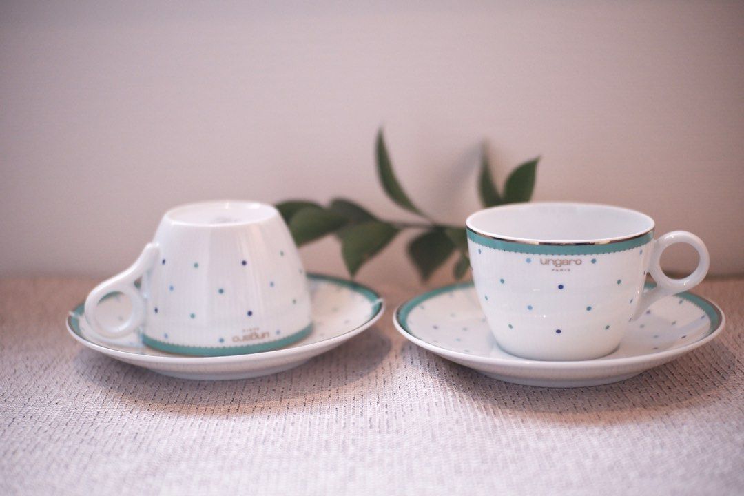 Ungaro Paris Tea Cup and Saucer Set (Category: Coffee & Tea Tableware) located in Binangonan. Submitted by pinkesceeluxe (Listing ID 1412477796, Image 3). Description: Elegant Ungaro Paris tea cup and saucer set. Php850 per set of cup and saucer - white base with blue polka dots and a teal and gold trim. - two cups and two saucers available - The cups have a comfortable handle and the saucers are a matching design. - Perfect for serving tea or co