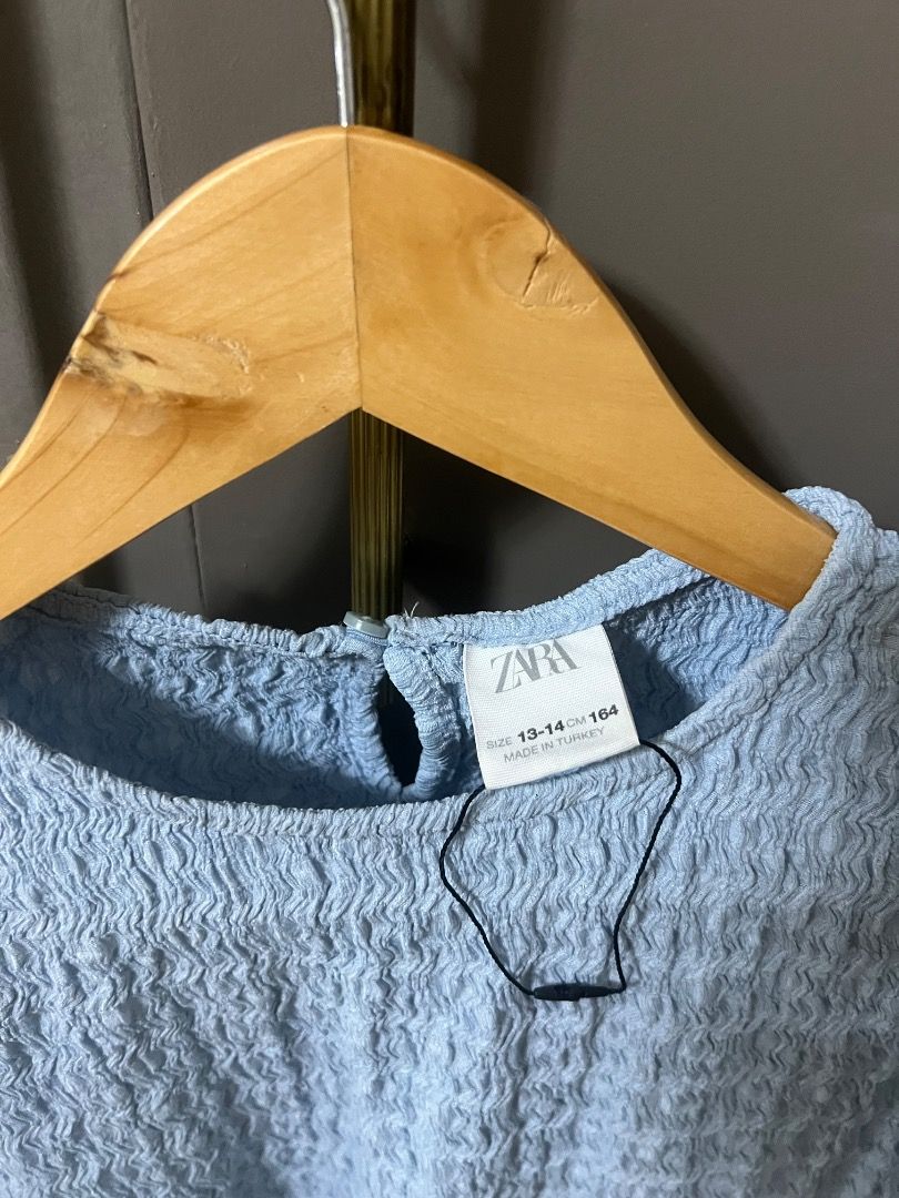 Zara blouse size S (Category: Blouses) located in Manila. Submitted by cluttercrushers (Listing ID 1412344727, Image 2). Description: Light blue textured ZARA blouse Can fit XS to Small adult size Petite Good condition.