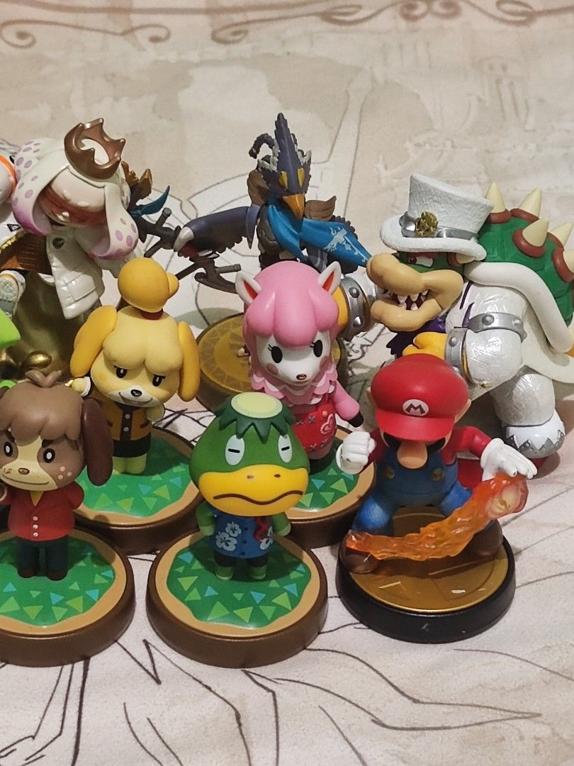 Amiibo 12 pcs WORKING (expect) brown digby animal crossing (Category: Figurines & Statues) located in Manila. Submitted by olx156 (Listing ID 1407660270, Image 3). Description: Brown Digby animal crossing (not working) face dents Mario Smash (fire ball end) dents Marie Splatoon (Splash) need to glued splash at the back .