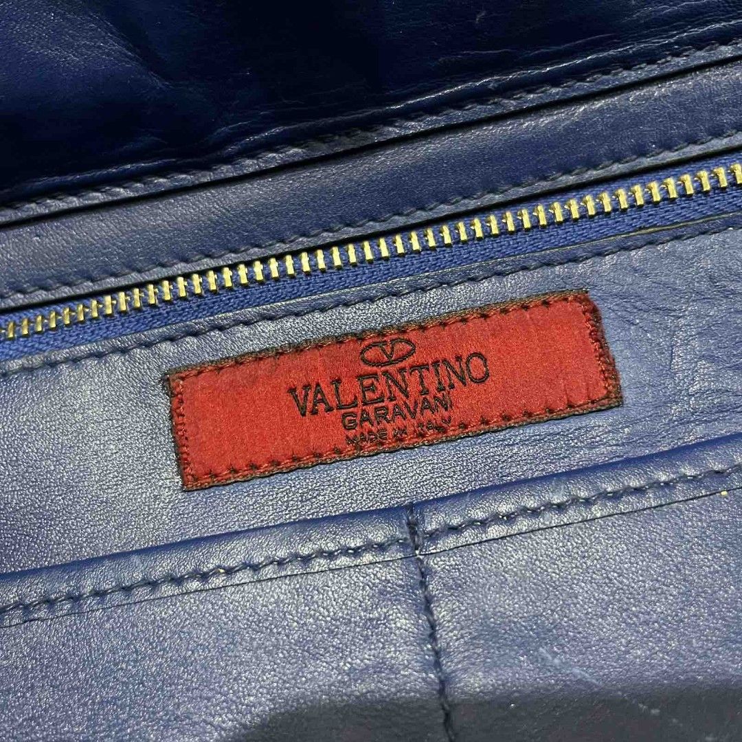Authentic Valentino Garavani Rockstud Tote Bag (Category: Luxury Bags & Wallets) located in Manila. Submitted by mkalelx (Listing ID 1407574318, Image 2). Description: FOR SALE: VALENTINO GARAVANI Rockstud Small Calfskin Leather 2-Ways Tote Bag Blue •Price: 30,000PHP OR BEST OFFER •Authentic •Location: Antipolo •Meetup: Robinsons Antipolo •Can ship via LBC, Lalamove, J&T. •Buyer shoulders the shipping fee. •Condition: This previously owned and us